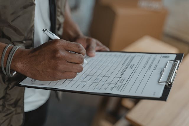 person looking over a checklist